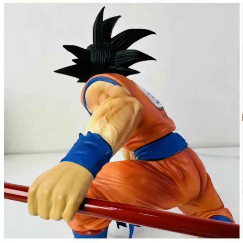Son Goku sitting with Stick Action Figure - Dragon Ball Z